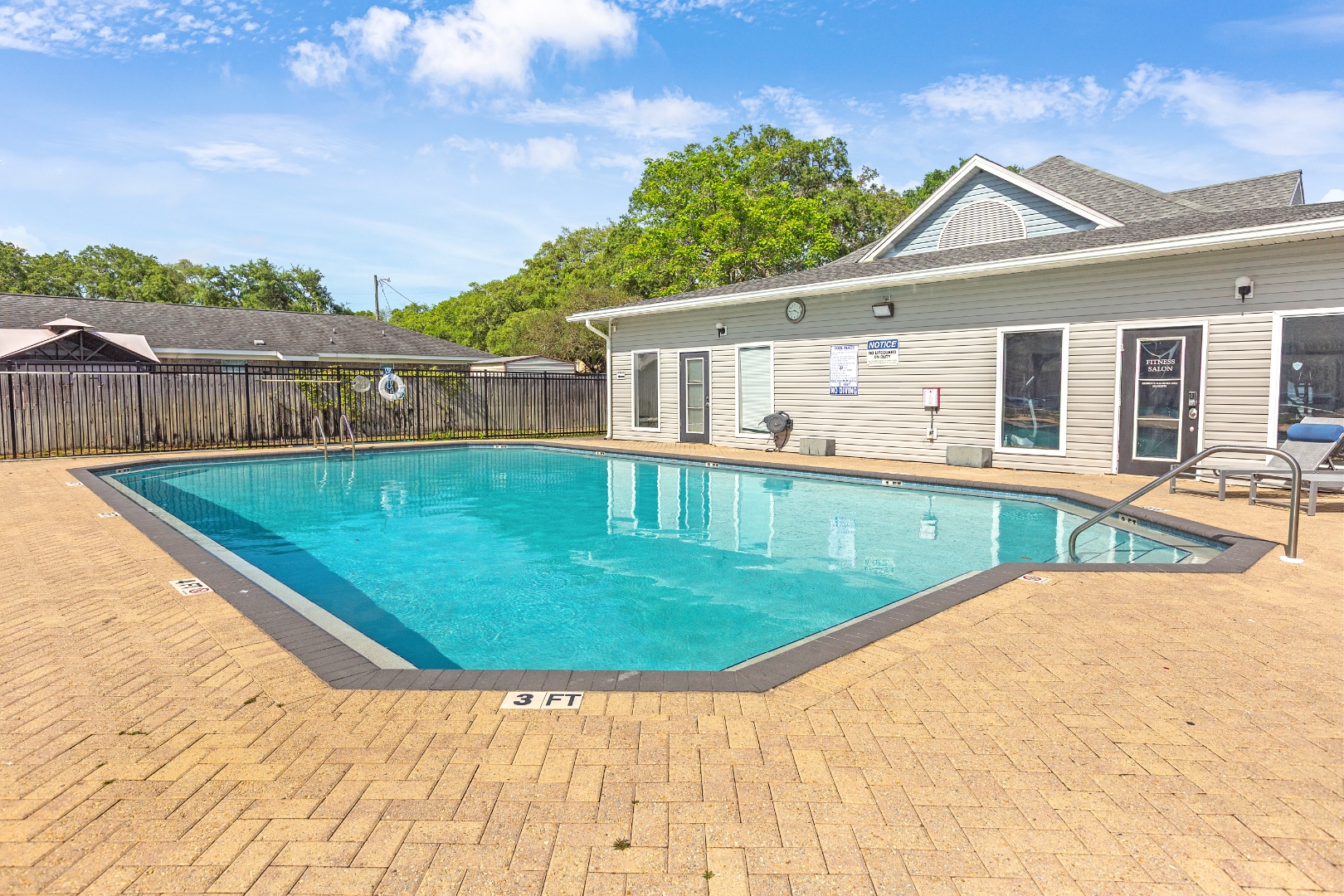 Resort-style pool with lounge chairs