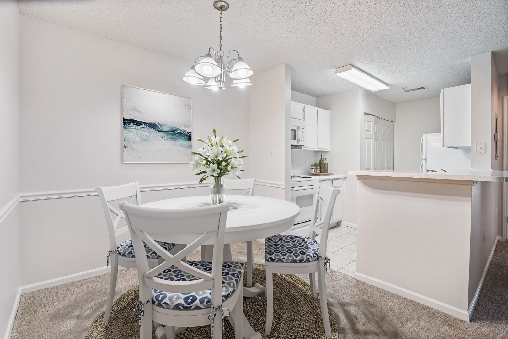 Dining area with chandelier and kitchen