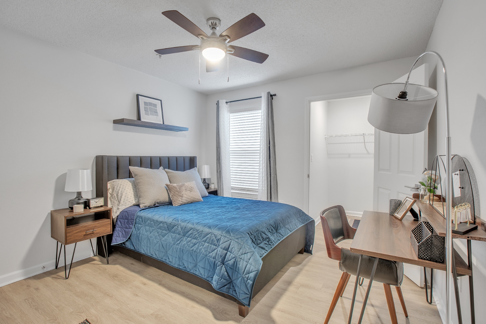 Bedroom with desk and closet