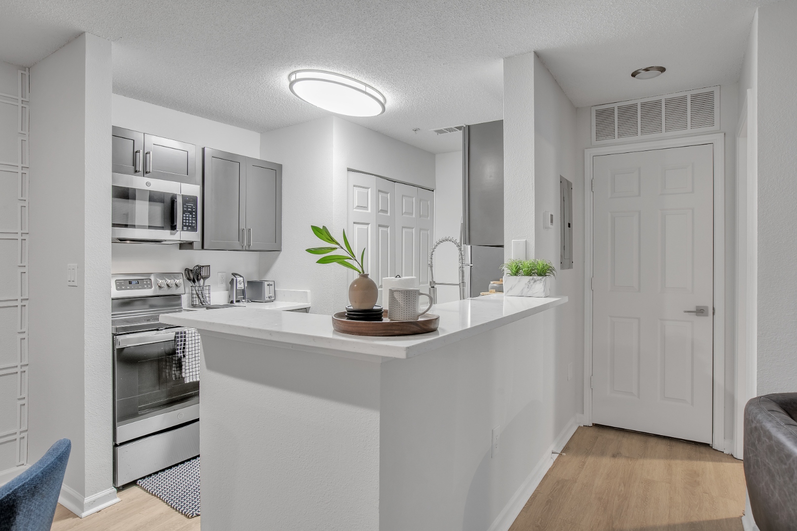 Kitchen with stainless appliances and peninsula